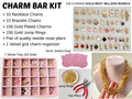 Professional Charm Bar Kit for Parties with 156 gold plated charms and 20 pre-assembled chains. The set includes a 24-grid pink velvet jewelry organizer tray, two red needle nose pliers, a pile of gold jump rings, and pink velvet jewelry bags. Displayed are assorted colorful charms, a thick paperclip chain necklace, and a complete DIY jewelry making station."